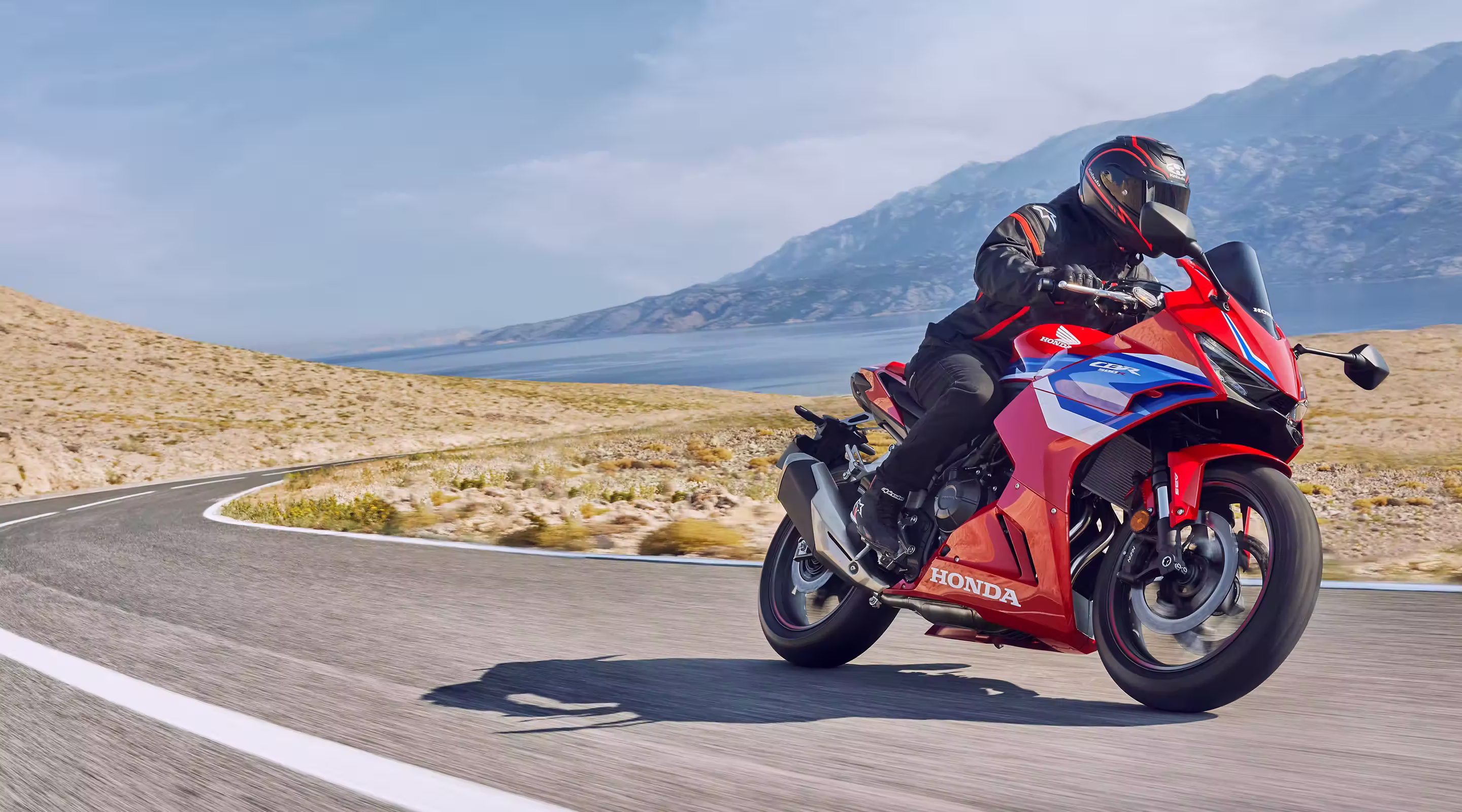 Motorcycle rider rounding a bend
