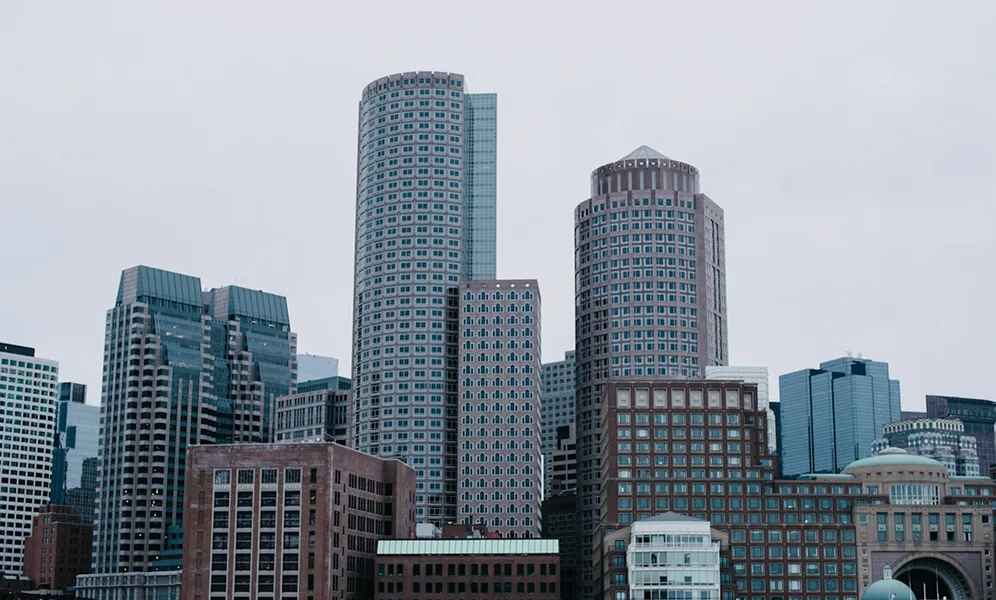 Boston skyline with tall skyscrapers and office buildings on cloudy day