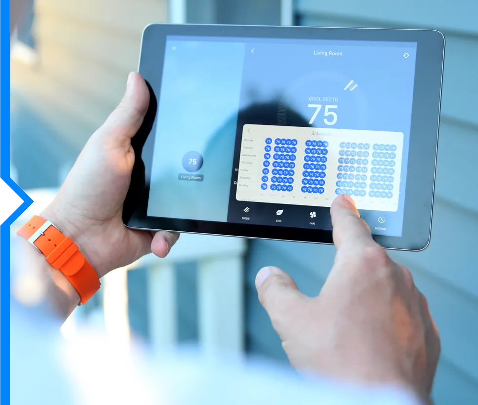 Smart home thermostat app on tablet with temperature set to 75 degrees