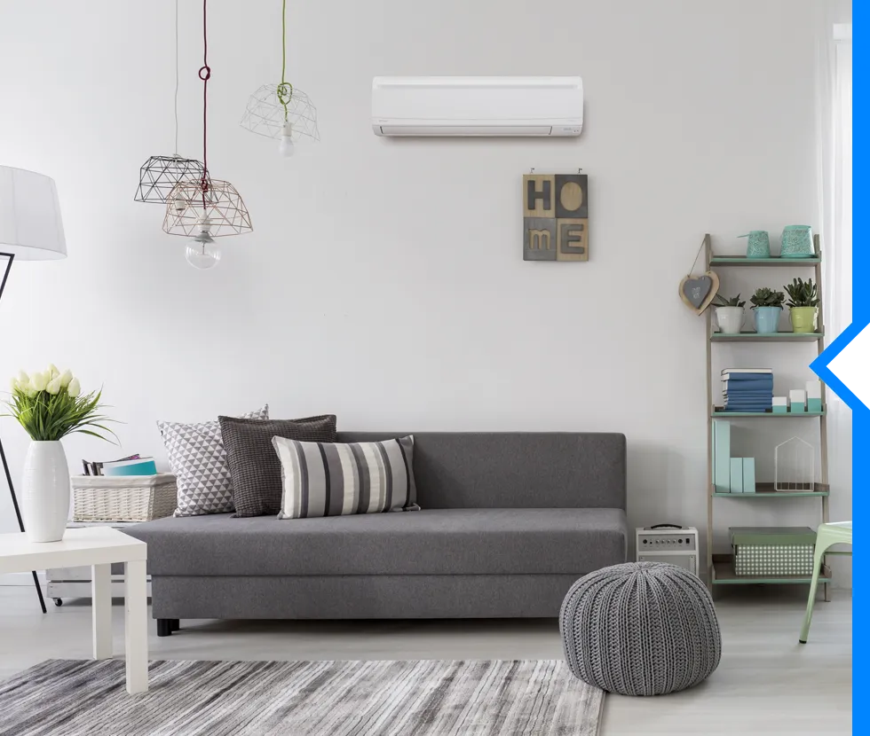 Modern living room with gray sofa, pendant lights, and minimalist decor