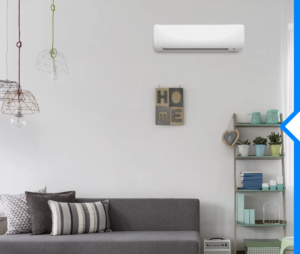 Minimalist living room with gray sofa, home decor, and air conditioner