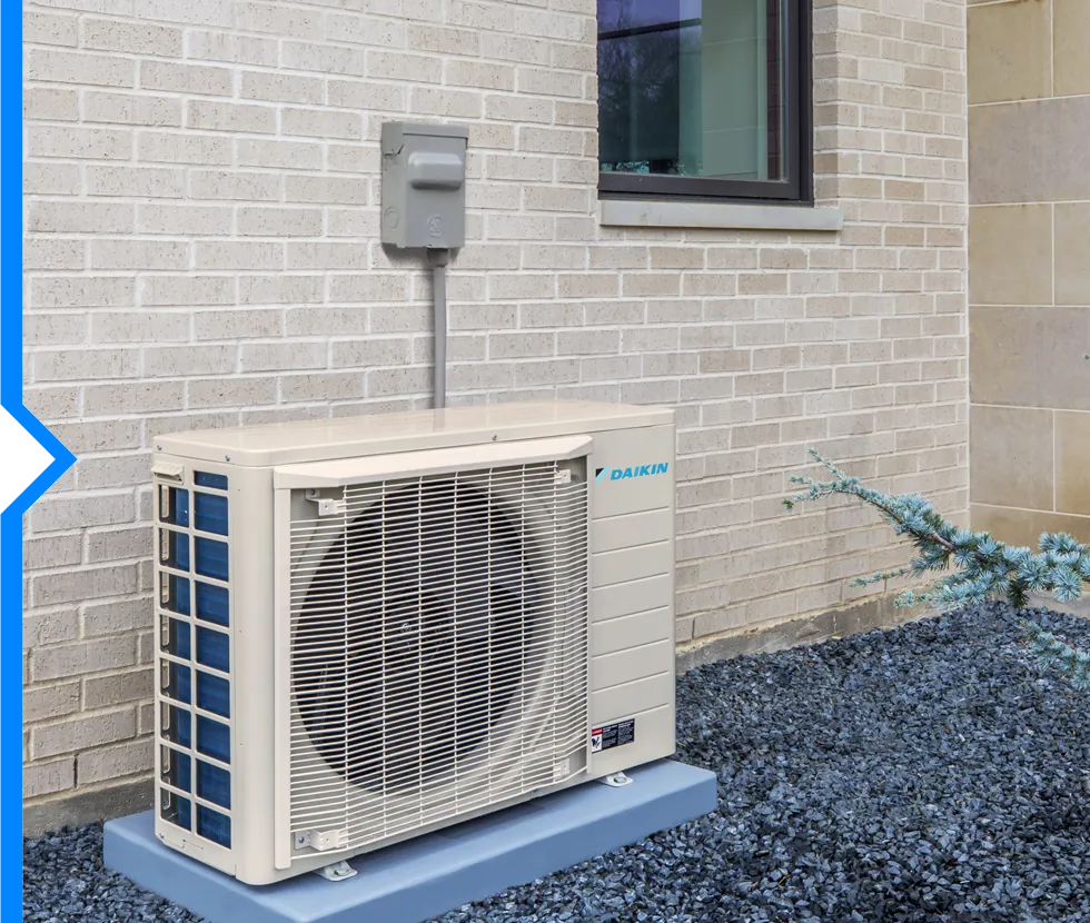 Daikin air conditioning unit mounted on blue stand near brick wall
