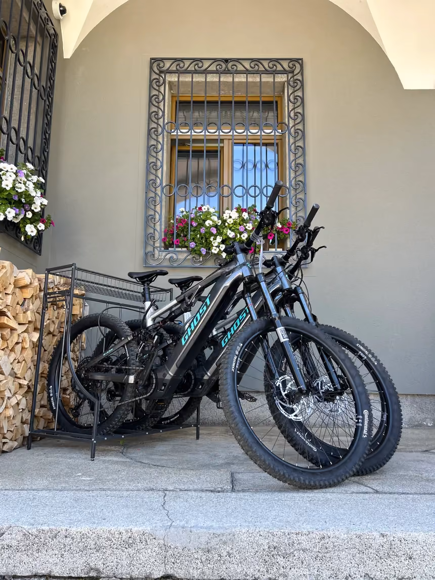 E-bikes parked in the rack outside Altein, Arosa
