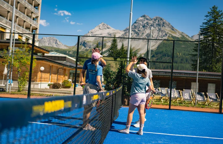Guests playing padel on the court at Altein, Arosa