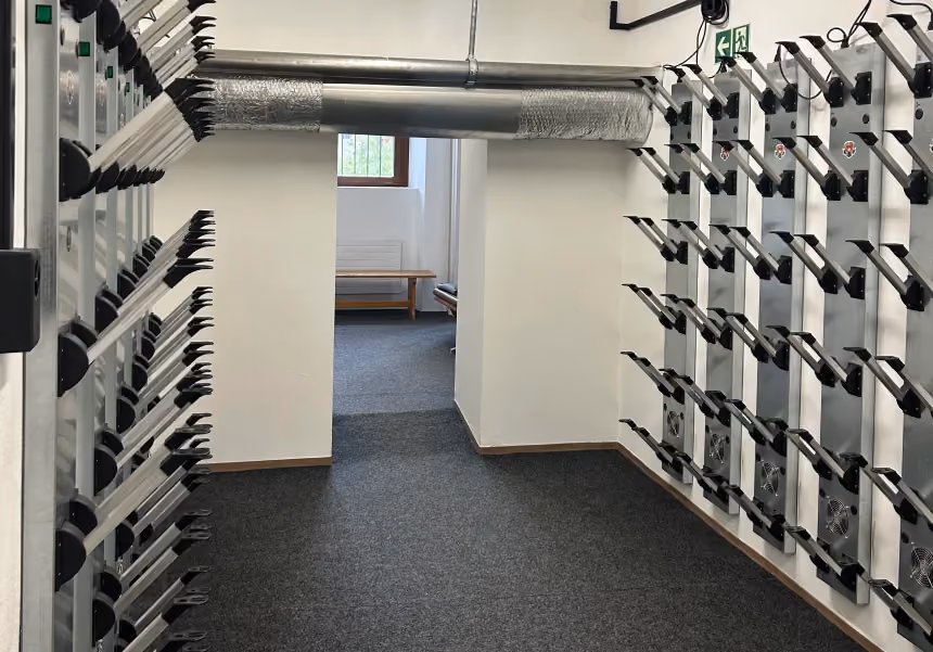 The ski and boot room at Altein, Arosa, with heated boot dryer racks