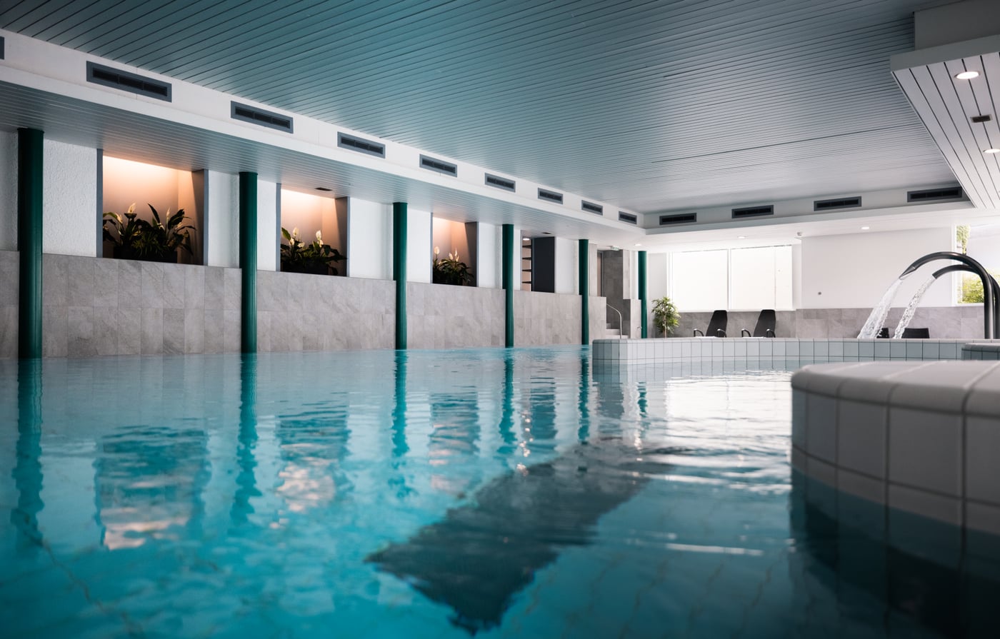The indoor pool at Victoria Lauberhorn, lit from a long window wall