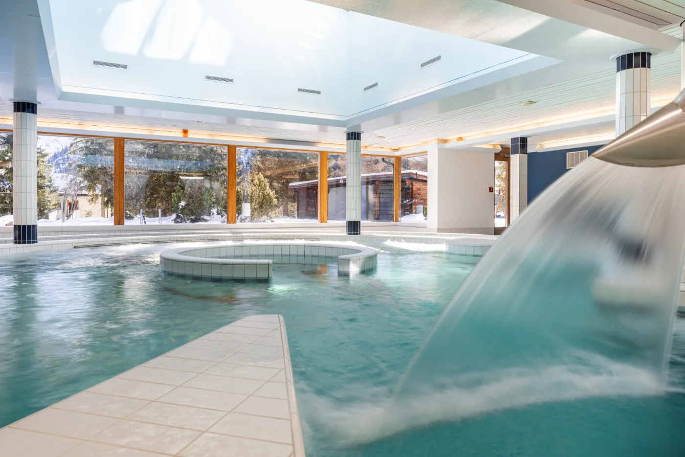 Lazy river and water cascade at Altein, snow outside