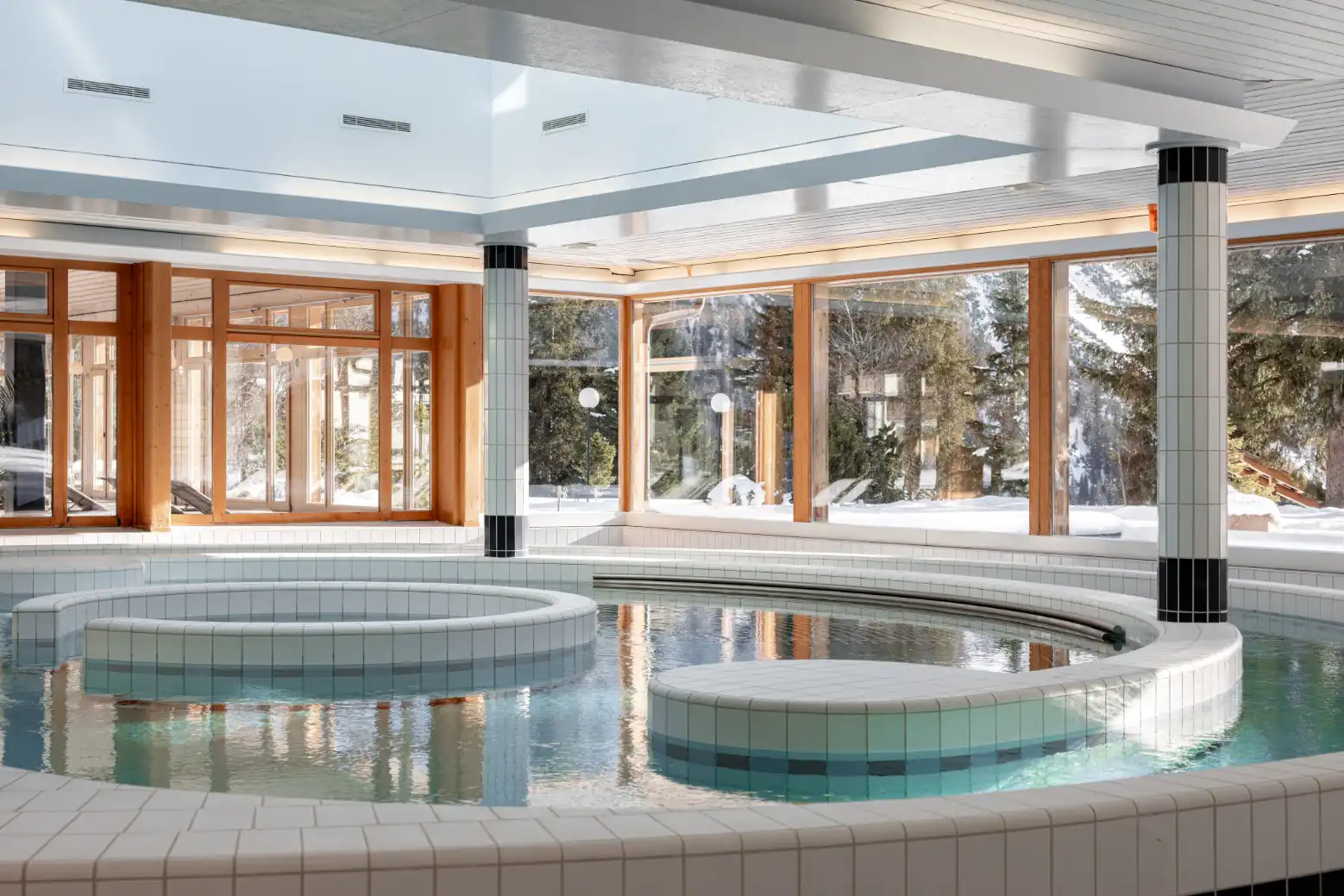 Indoor pool at Altein with a winter view