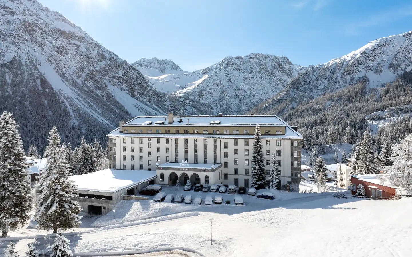 Altein, Arosa in winter with snow-capped mountains behind