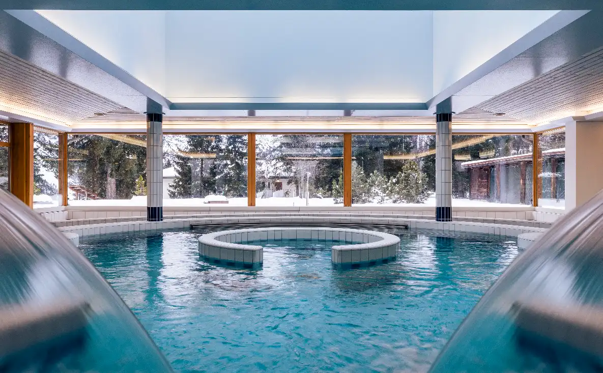 Indoor pool at Altein with snow outside the windows