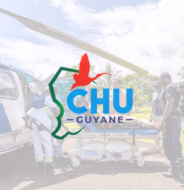 Medical team transfers patient on stretcher to helicopter, preparing for airlift.