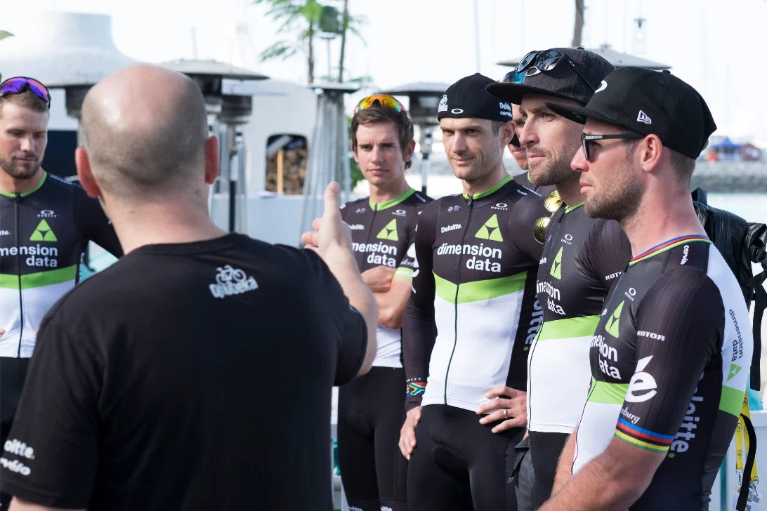 Cycling team in kit before a launch