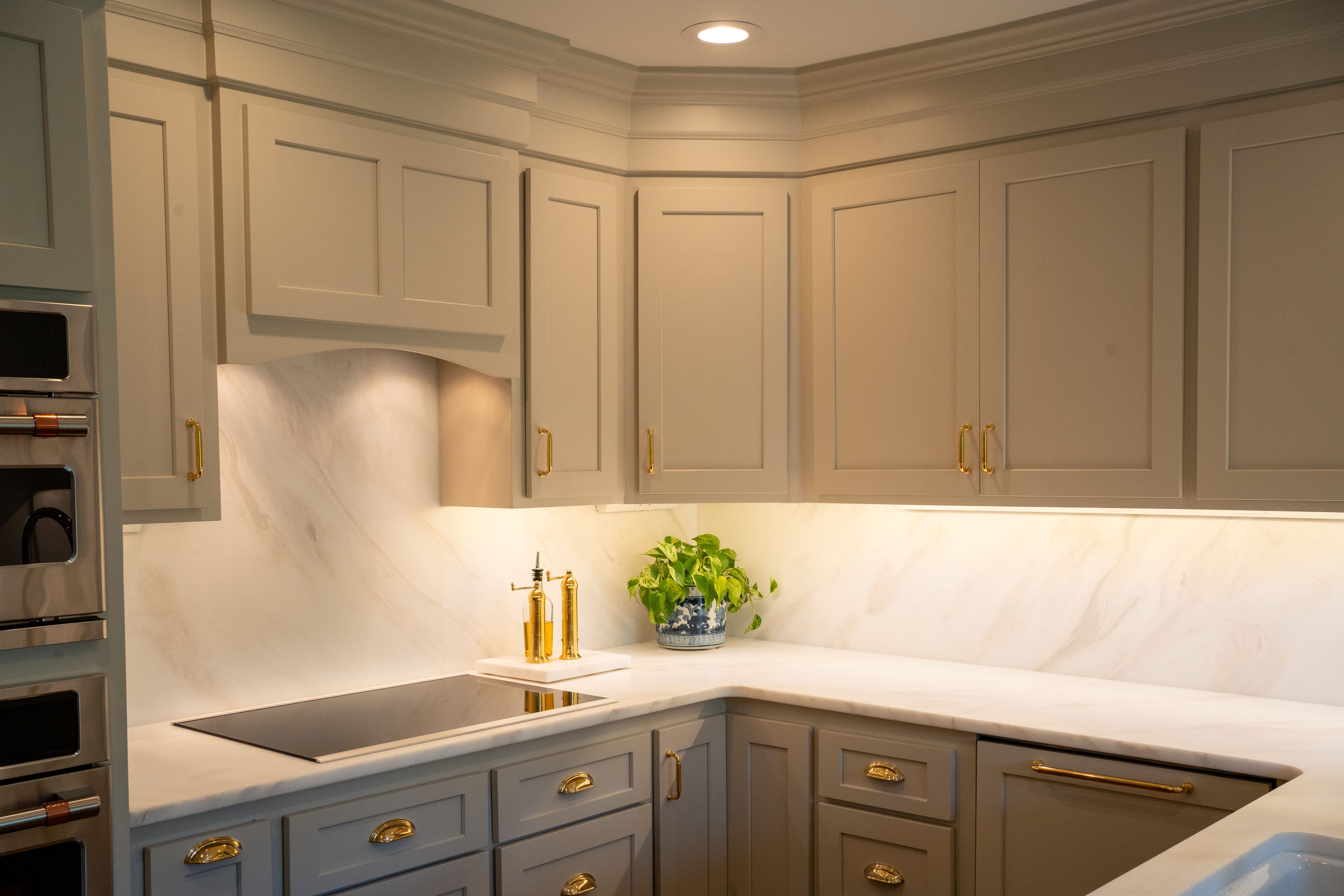 A timeless kitchen featuring 3CM Bianco Rhino Honed Marble, selected for its soft natural veining and elegant matte finish. The full-height backsplash creates a seamless, sophisticated look while showcasing the beauty of natural stone.