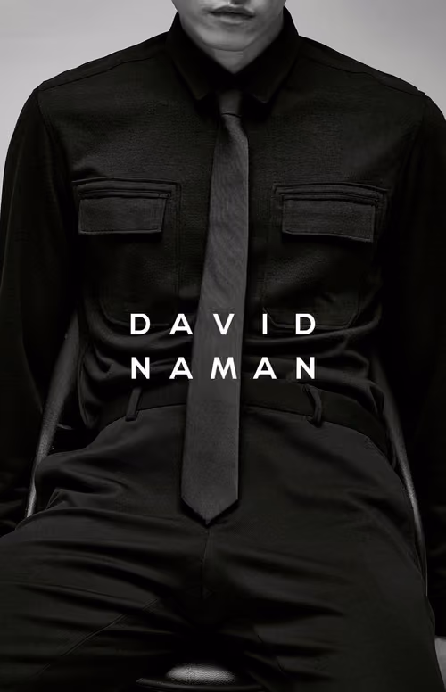 David Naman logo over a model in a black shirt and tie