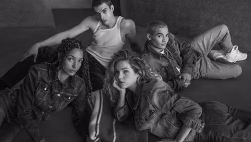 Gas Jeans campaign: four models in denim lounging, black and white