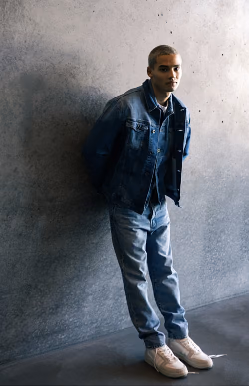 Gas Jeans: man in a denim jacket and light jeans