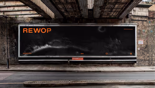 Rewop billboard under a bridge