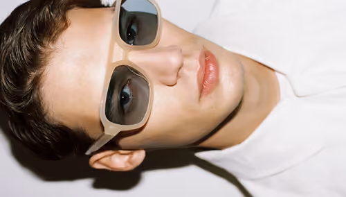 District People: model wearing beige-frame sunglasses