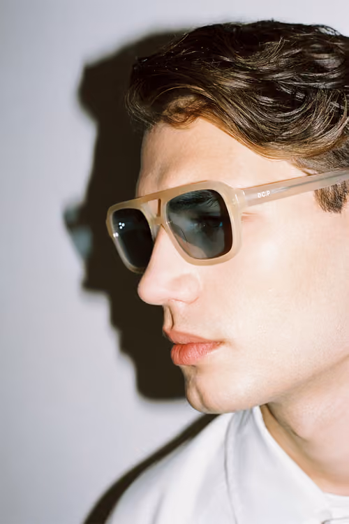 District People: profile of a model wearing tinted aviator sunglasses