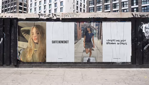 Suite Benedict campaign posters on a street wall