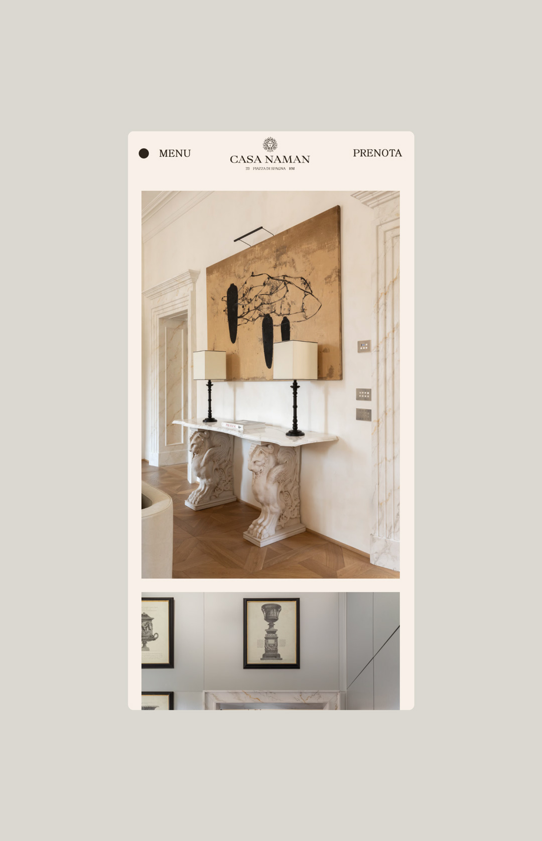 Casa Naman website on mobile: marble console with lamps and a painting