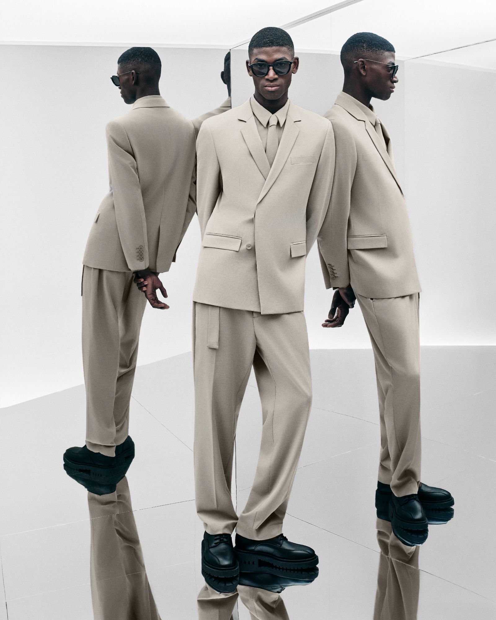 Antony Morato beige double-breasted suit reflected in mirrors