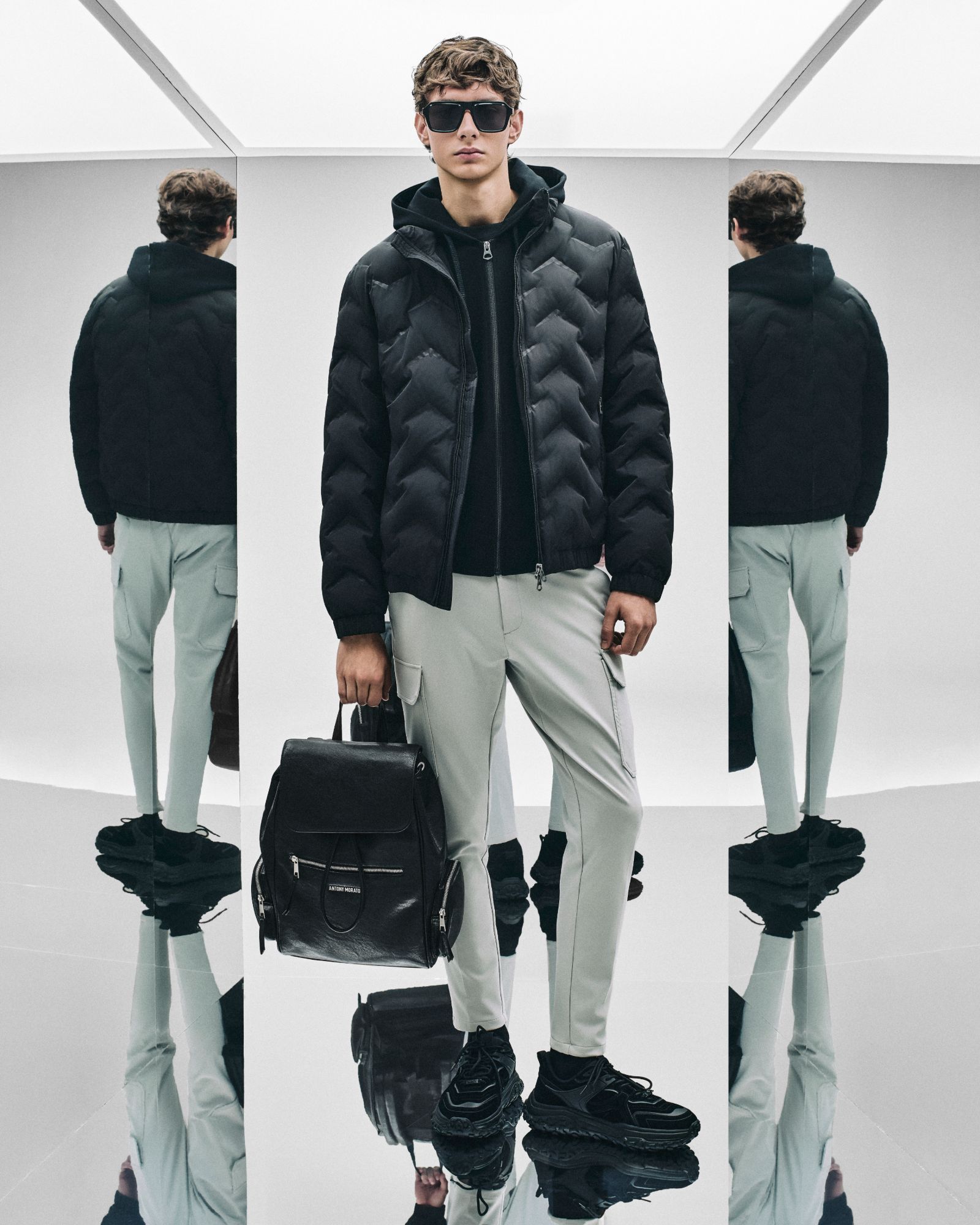Antony Morato puffer jacket and cargo trousers shot between mirrors