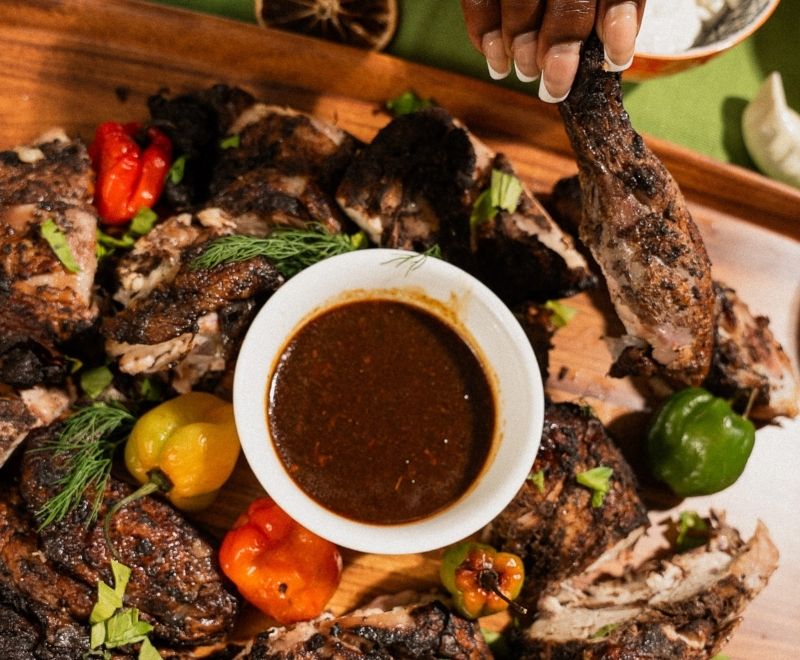 Jerk chicken dish, as a symbol of celebrating different traditions.