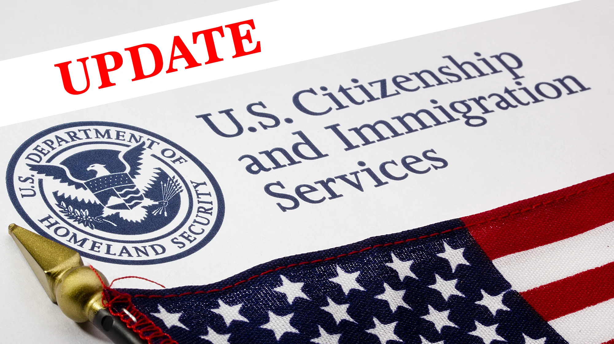 Illustration of USCIS envelop with "Update" inscription on image.