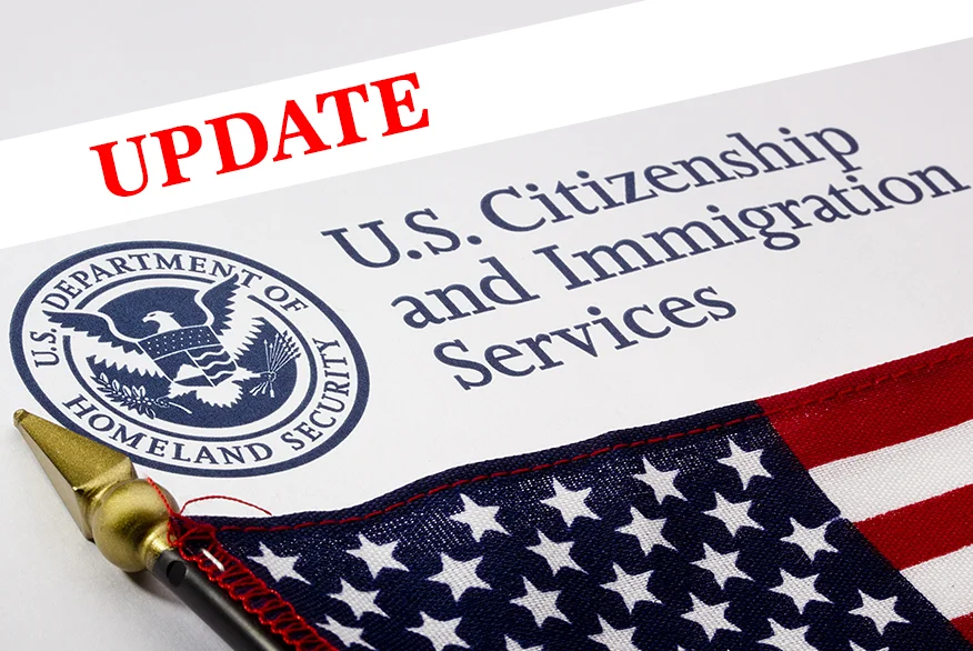 Illustration of USCIS envelop with "Update" inscription on image.