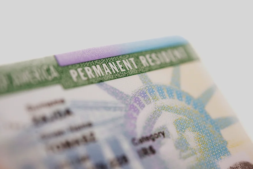 Close up picture of a US Permanent Resident Card (Green Card).