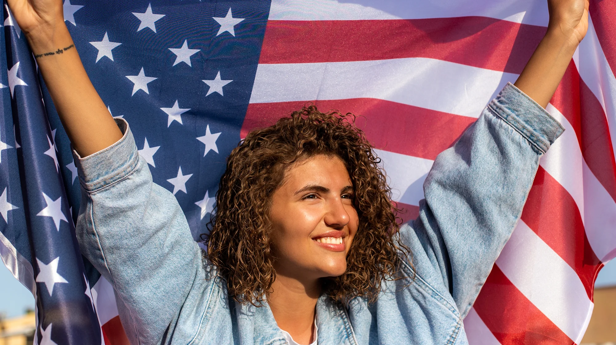 A woman holding US flag.