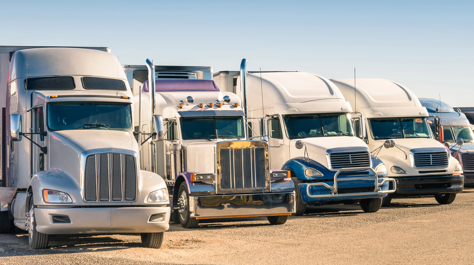 Semi trucks parked at the truck stop.