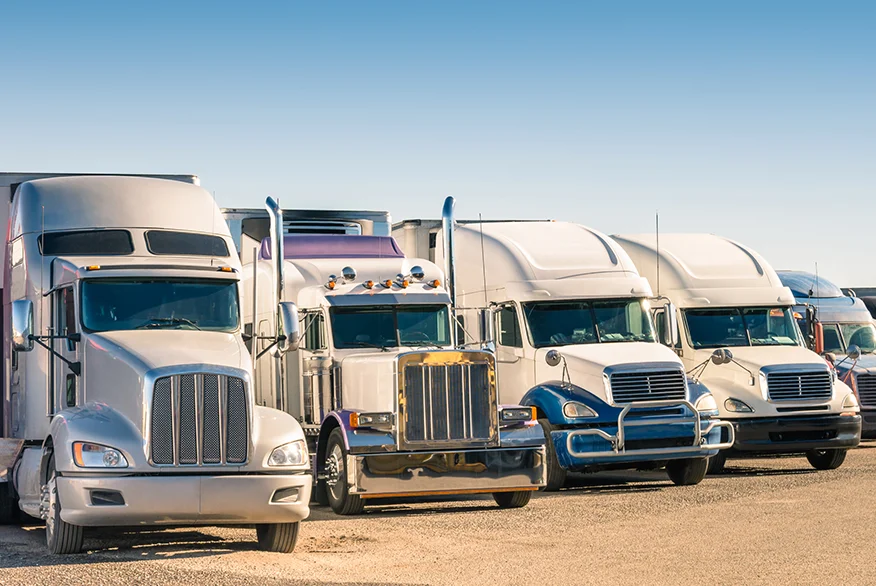 Semi trucks parked at the truck stop.