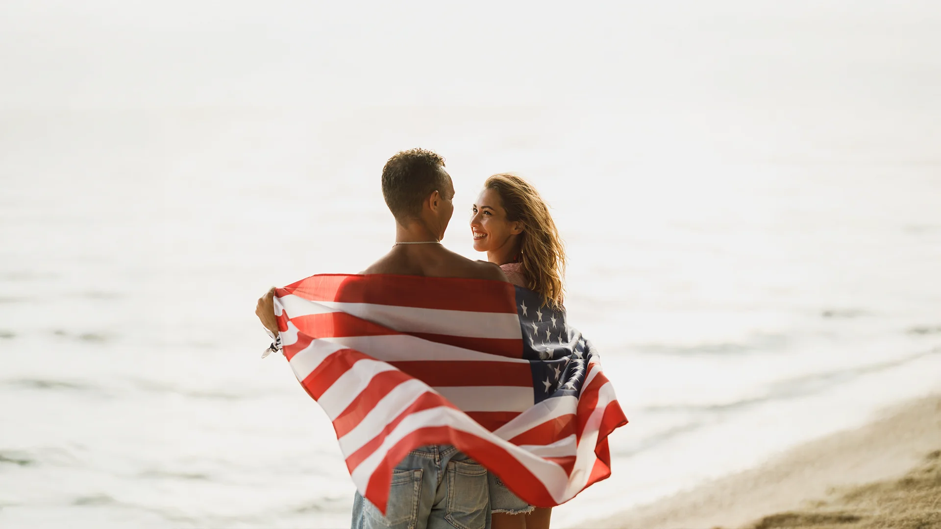 A couple holding US Flag