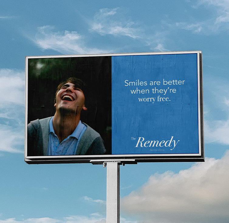 blue billboard with the phrase "smiles are better when they are worry free"