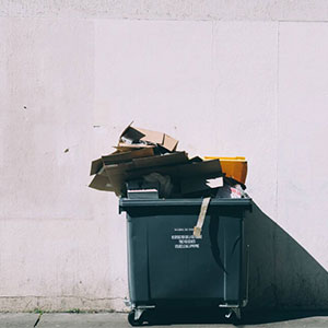 Trash bin full of paper and carton boxes.