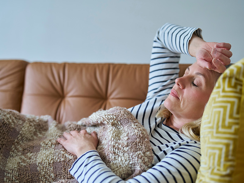 woman laying on couch