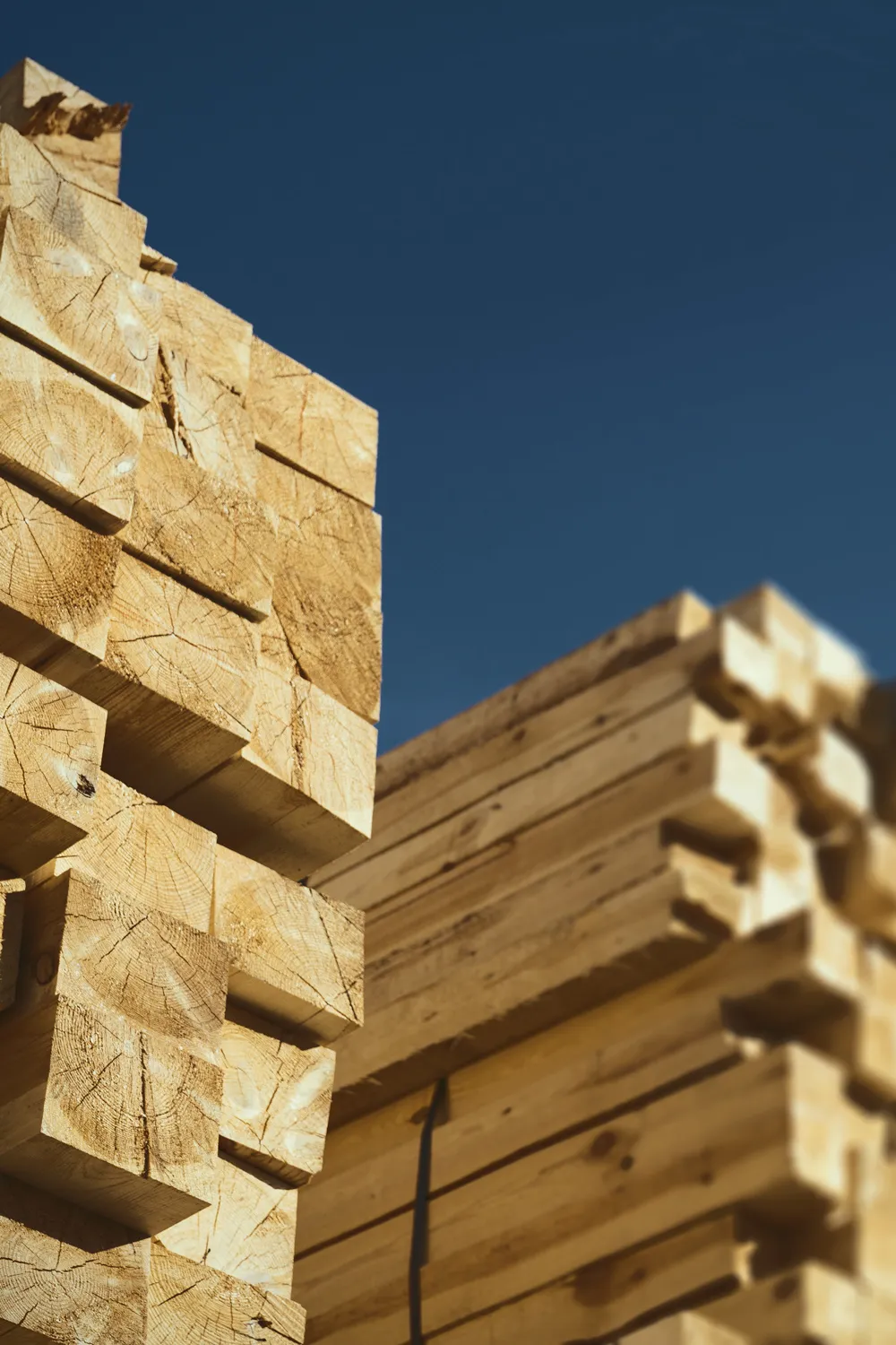 A close up photo of a stack of lumber