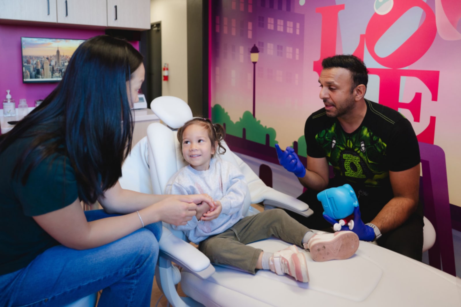 Dentist applying sealant treatment to a child's back teeth during a procedure
