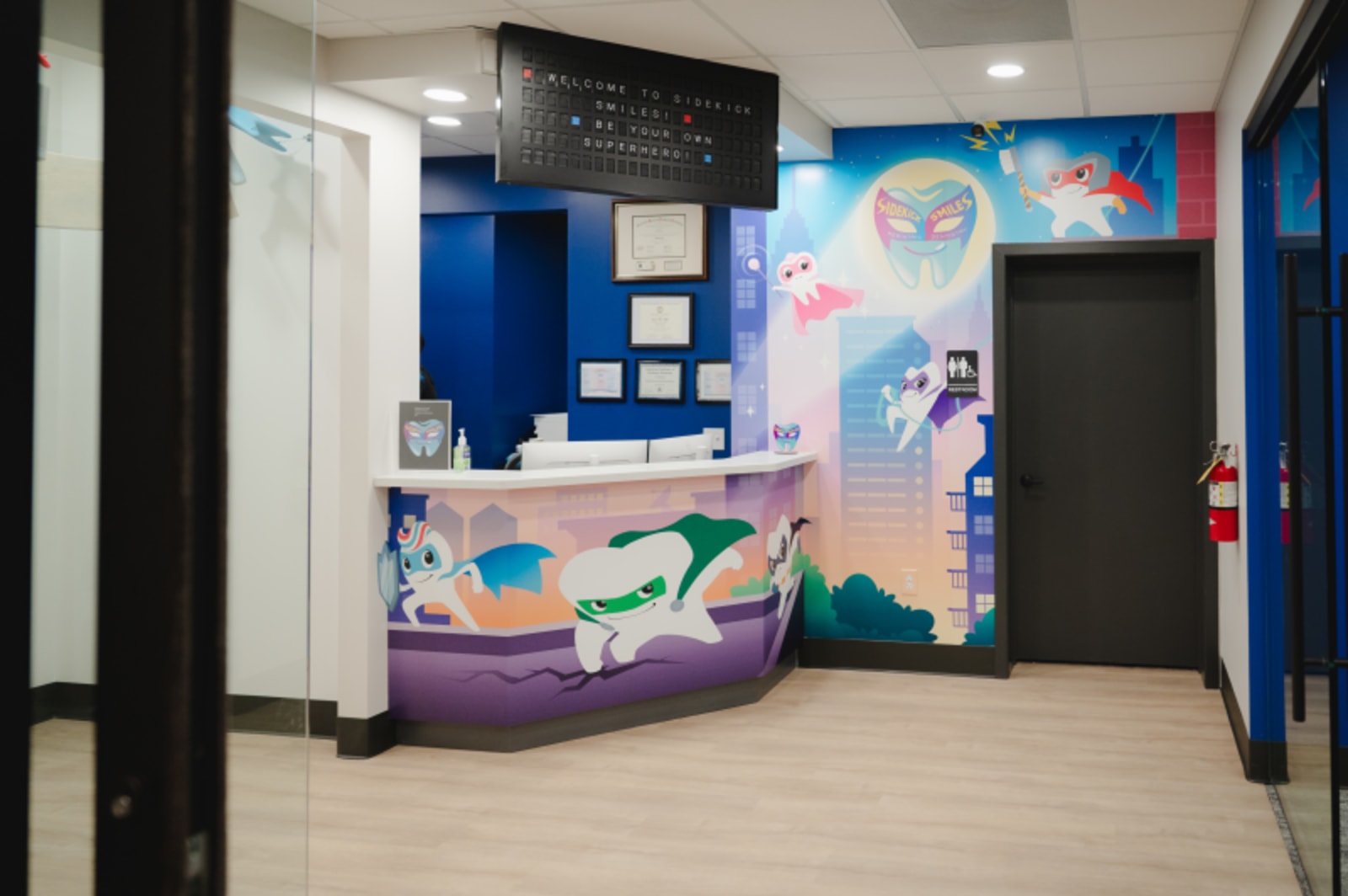 Bright, colorful pediatric dental office with vibrant murals and welcoming design