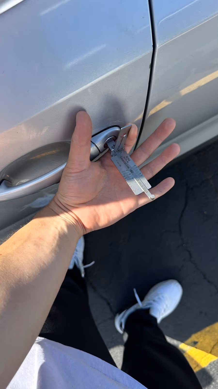 Locksmith unlocking Toyota Camry at Forest Park in Noblesville using professional tools