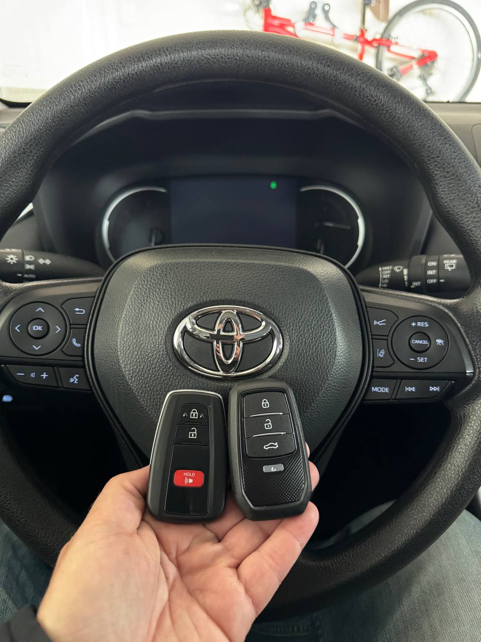 Mobile locksmith making a duplicate car key in Fishers, IN