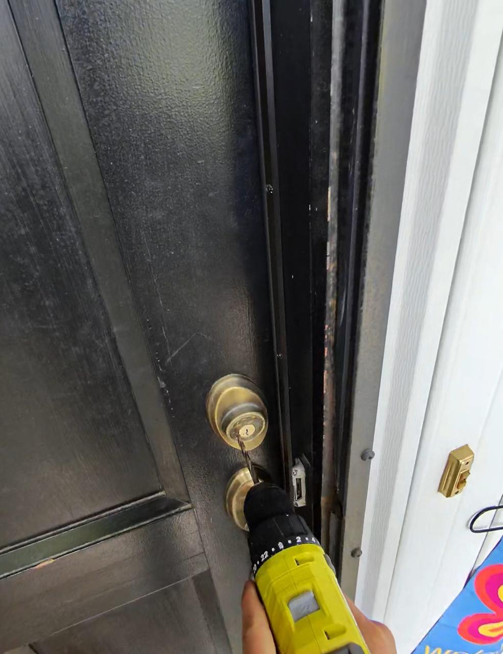 locksmith performing door lockout