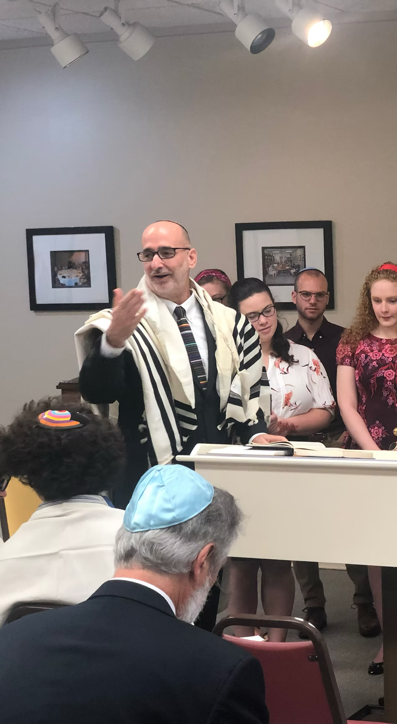 Rabbi chanting at the torah with cantorial soloist
