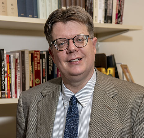 Flier of a professor's headshot for a lecture series