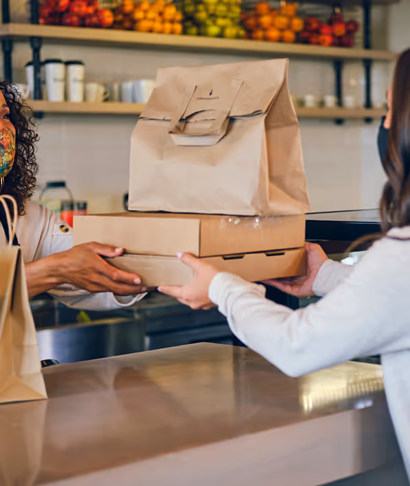 woman pickup up food at a restaurant