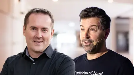 Zwei Männer mit dunklen Haaren und dunkler Kleidung.