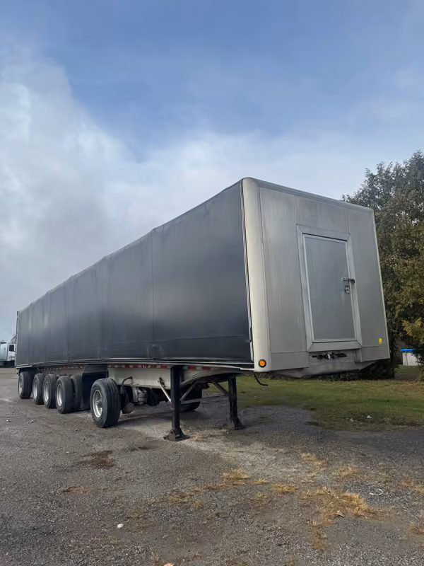 Manac flatbed trailer with Verduyn tarp system financed for commercial transport in Canada