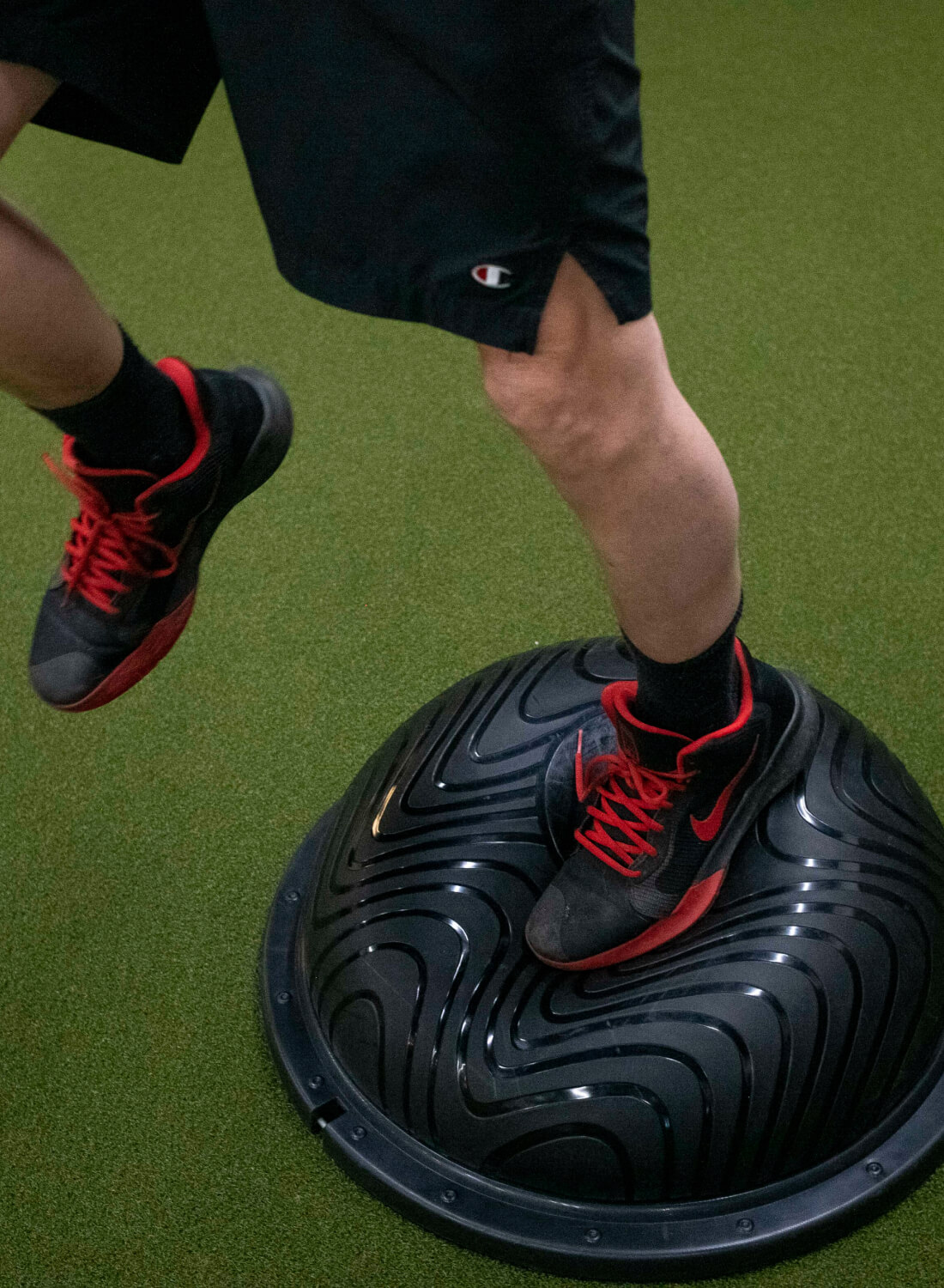 Foot balancing on a bosu ball. 